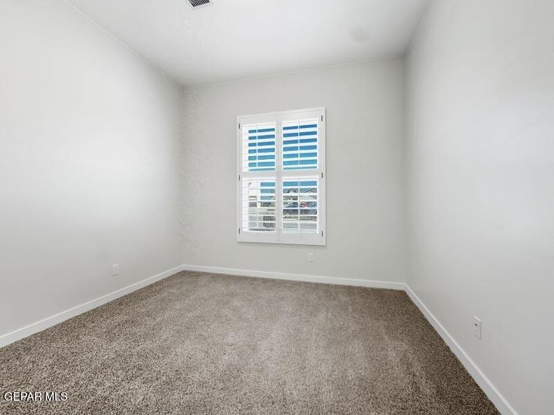 7248 Cimarron Rim Drive El Paso, TX 79911 - Photo 44 of 48 an empty room with a window