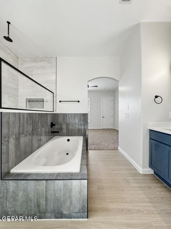 7248 Cimarron Rim Drive El Paso, TX 79911 - Photo 6 of 48 a bathroom with a tub and a shower