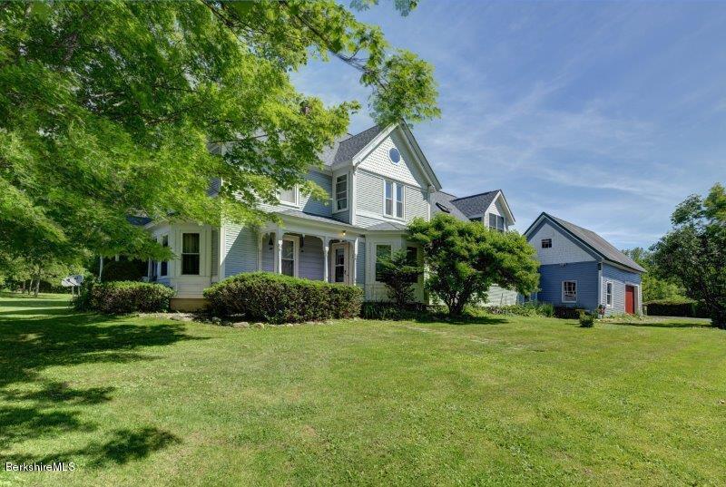 188 Huntington Road Worthington, MA 01098 - Photo 1 of 37 a front view of a house with a yard