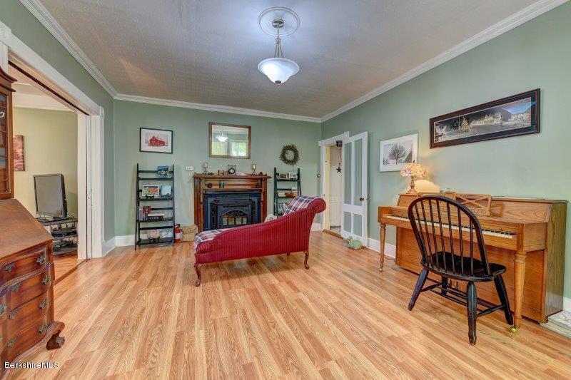 188 Huntington Road Worthington, MA 01098 - Photo 12 of 37 a living room with furniture a flat screen tv and a fireplace