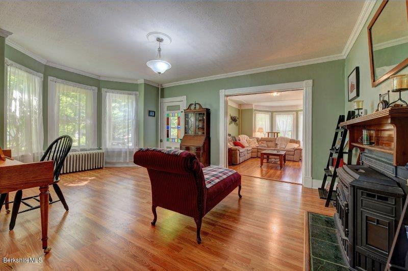 188 Huntington Road Worthington, MA 01098 - Photo 13 of 37 a living room with furniture a fireplace and a flat screen tv