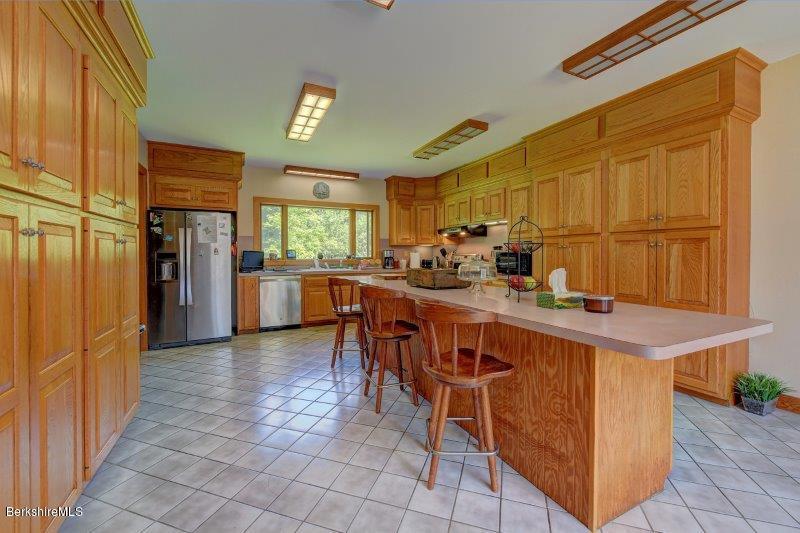188 Huntington Road Worthington, MA 01098 - Photo 14 of 37 a kitchen with stainless steel appliances granite countertop a stove a sink dishwasher and a refrigerator