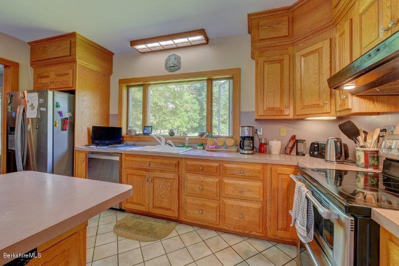 188 Huntington Road Worthington, MA 01098 - Photo 16 of 37 a kitchen with stainless steel appliances granite countertop a sink and a stove