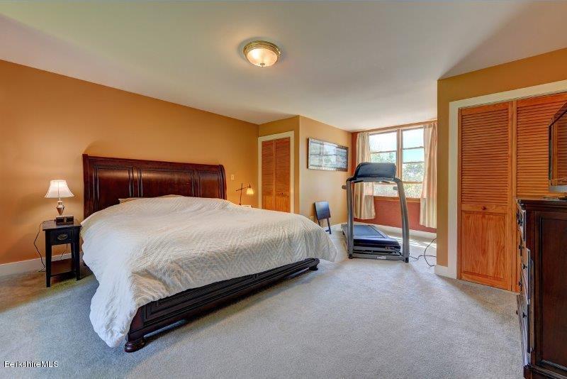 188 Huntington Road Worthington, MA 01098 - Photo 22 of 37 a bed sitting in a bedroom next to a window