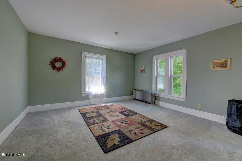188 Huntington Road Worthington, MA 01098 - Photo 28 of 37 an empty room with windows and closet