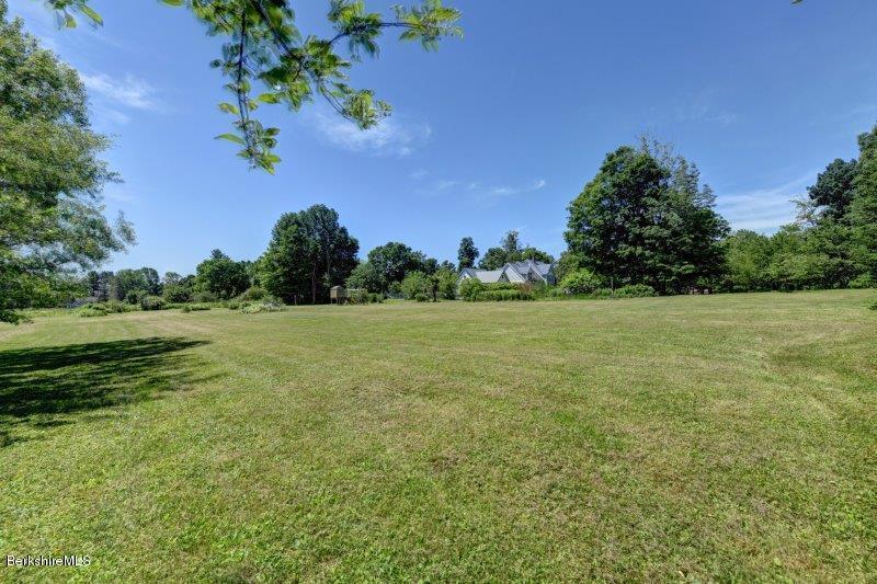 188 Huntington Road Worthington, MA 01098 - Photo 37 of 37 a view of a garden with a building in the background