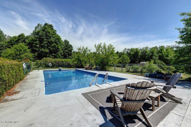 188 Huntington Road Worthington, MA 01098 - Photo 7 of 37 a view of patio with lawn chairs and wooden fence