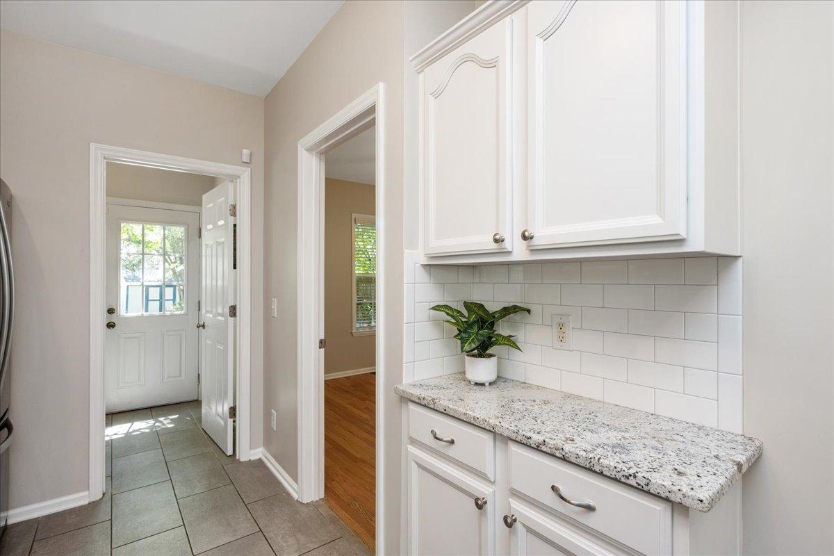 406 Pershing Road Raleigh, NC 27608 - Photo 17 of 29 a bathroom with a granite countertop sink and potted plant