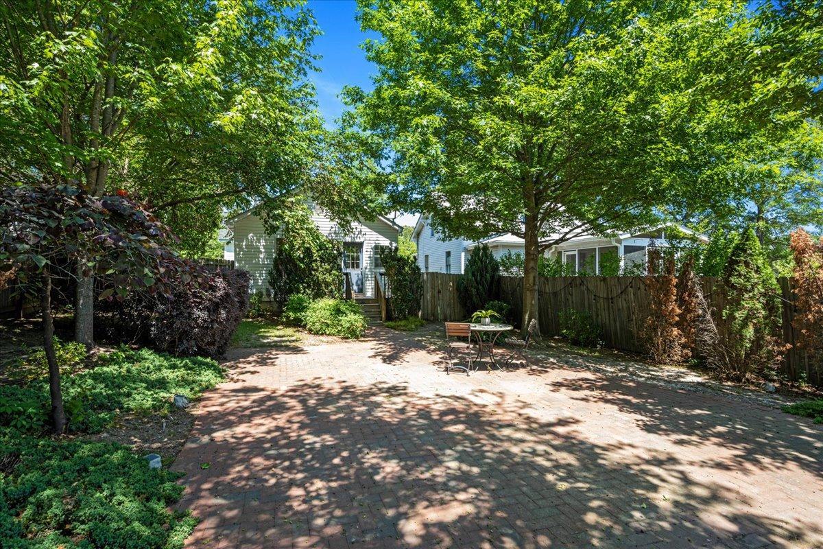 406 Pershing Road Raleigh, NC 27608 - Photo 4 of 29 a view of a tree in front of a house
