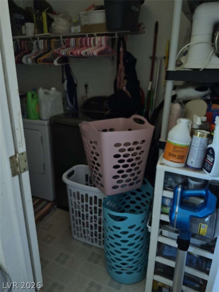 2271 Tough Boy Road Pahrump, NV 89060 - Photo 10 of 12 A dedicated laundry space offers convenience with ample shelving for essentials.