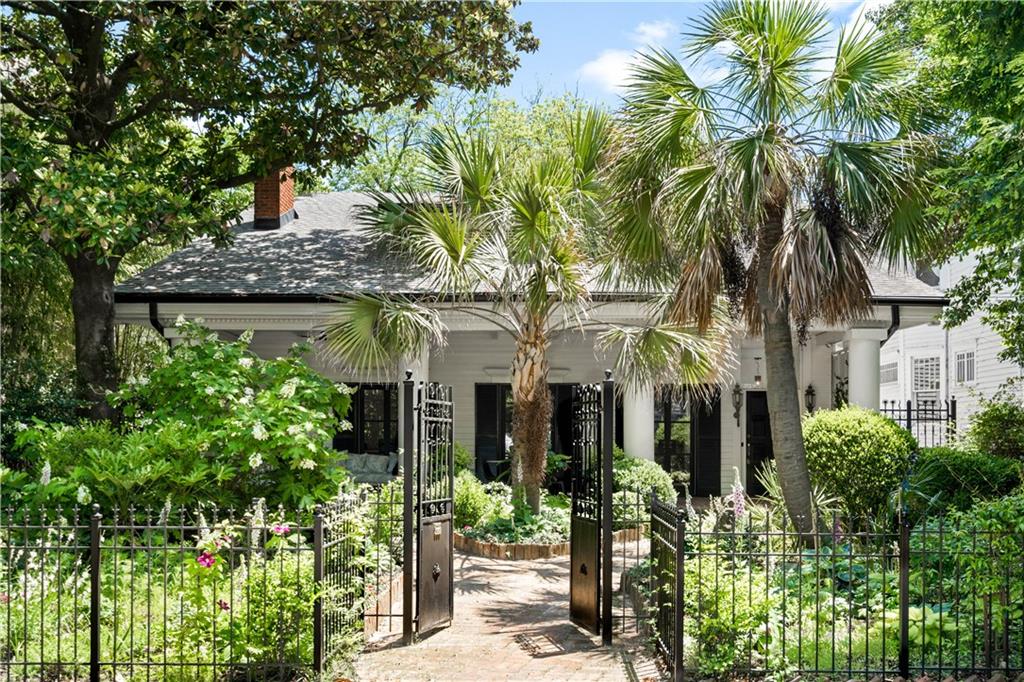 front view of a house with a garden