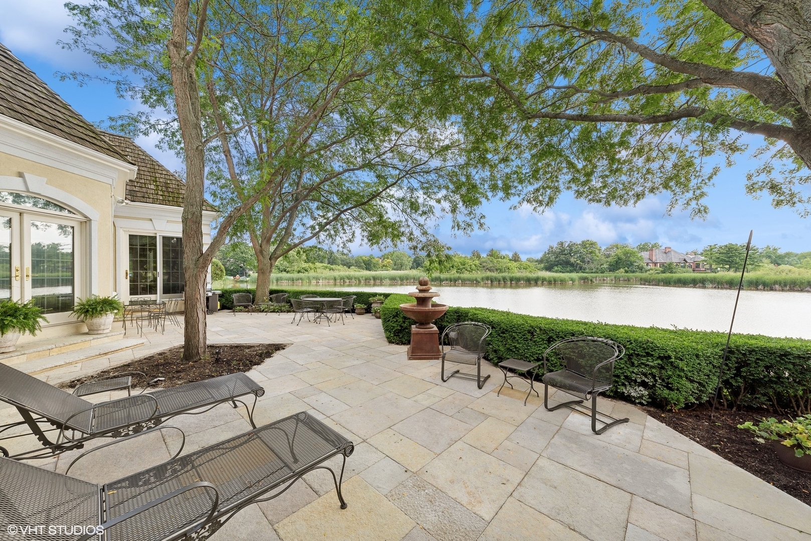 31 Riderwood Road North Barrington, IL 60010 - Photo 30 of 35 a view of a patio with lawn chairs under an umbrella