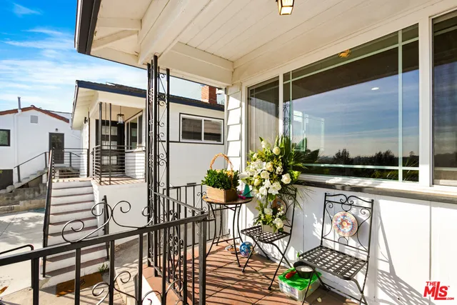 a view of a porch with seating space