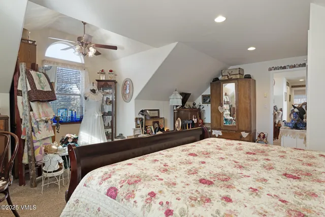 a bed room with a bed and a large mirror