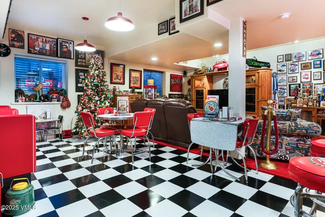 a living room filled with furniture and a book shelf