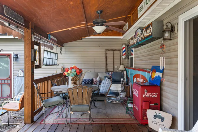 a view of a house with backyard porch and sitting area