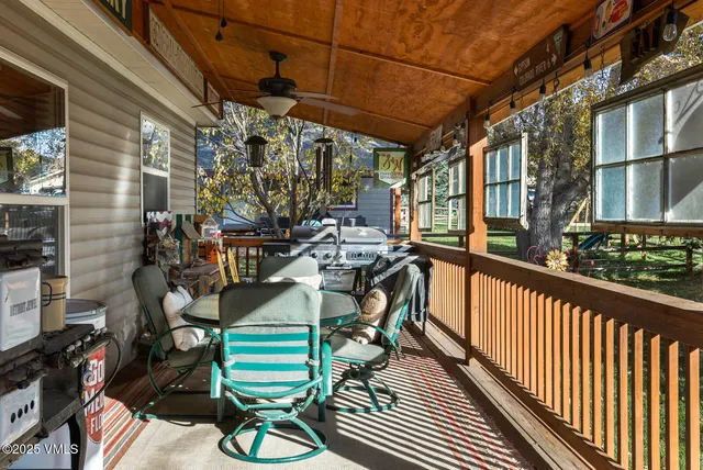 a view of a house with a yard and deck
