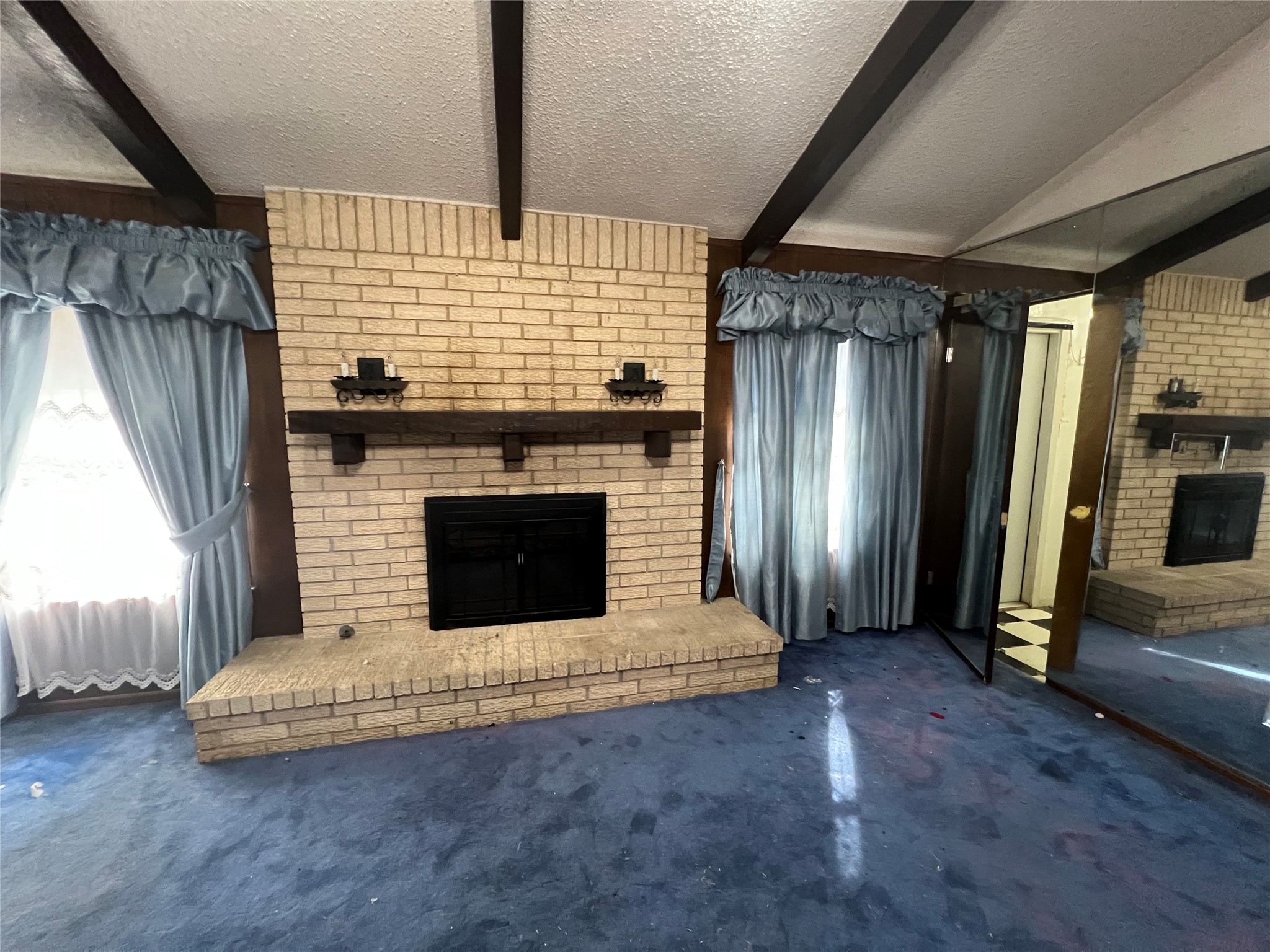 1302 Oak Shadows Circle Austin, TX 78758 - Photo 14 of 34 Notice the secret room to right of fireplace in the glass, also leads to a back door to outside.