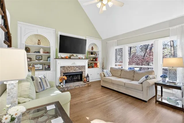 a living room with furniture or stairs and a wooden floor