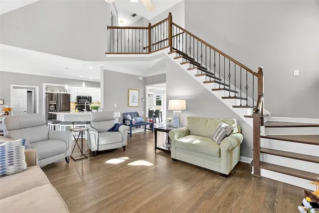 a bedroom with a bed a couch and dresser