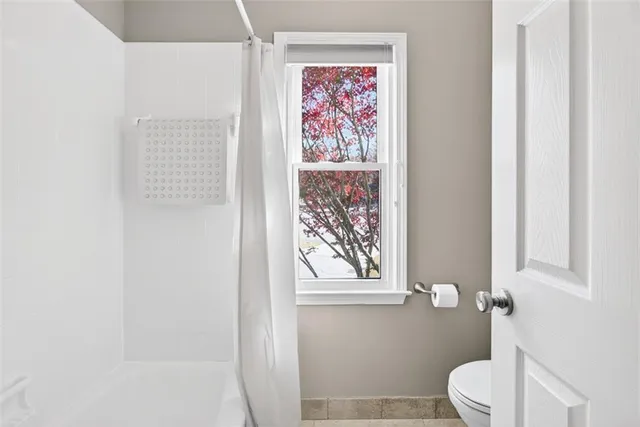 a dining room with a table and chairs