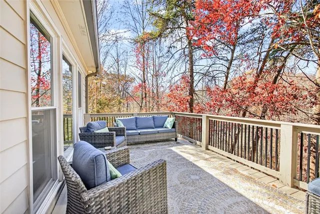 a living room with a table and wooden floor
