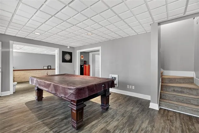 a view of a livingroom with workspace and a window