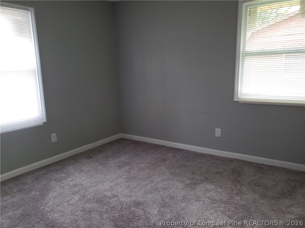 724 Spruce Street Lumberton, NC 28358 - Photo 11 of 13 an empty room with a window