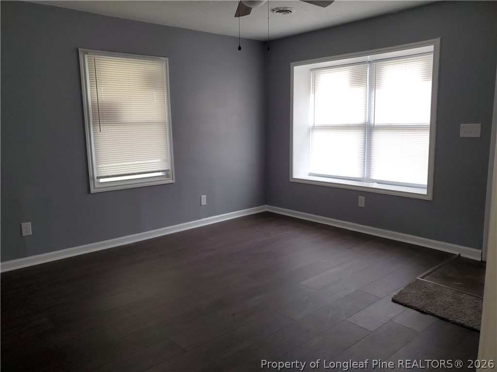 724 Spruce Street Lumberton, NC 28358 - Photo 2 of 13 an empty room with a window