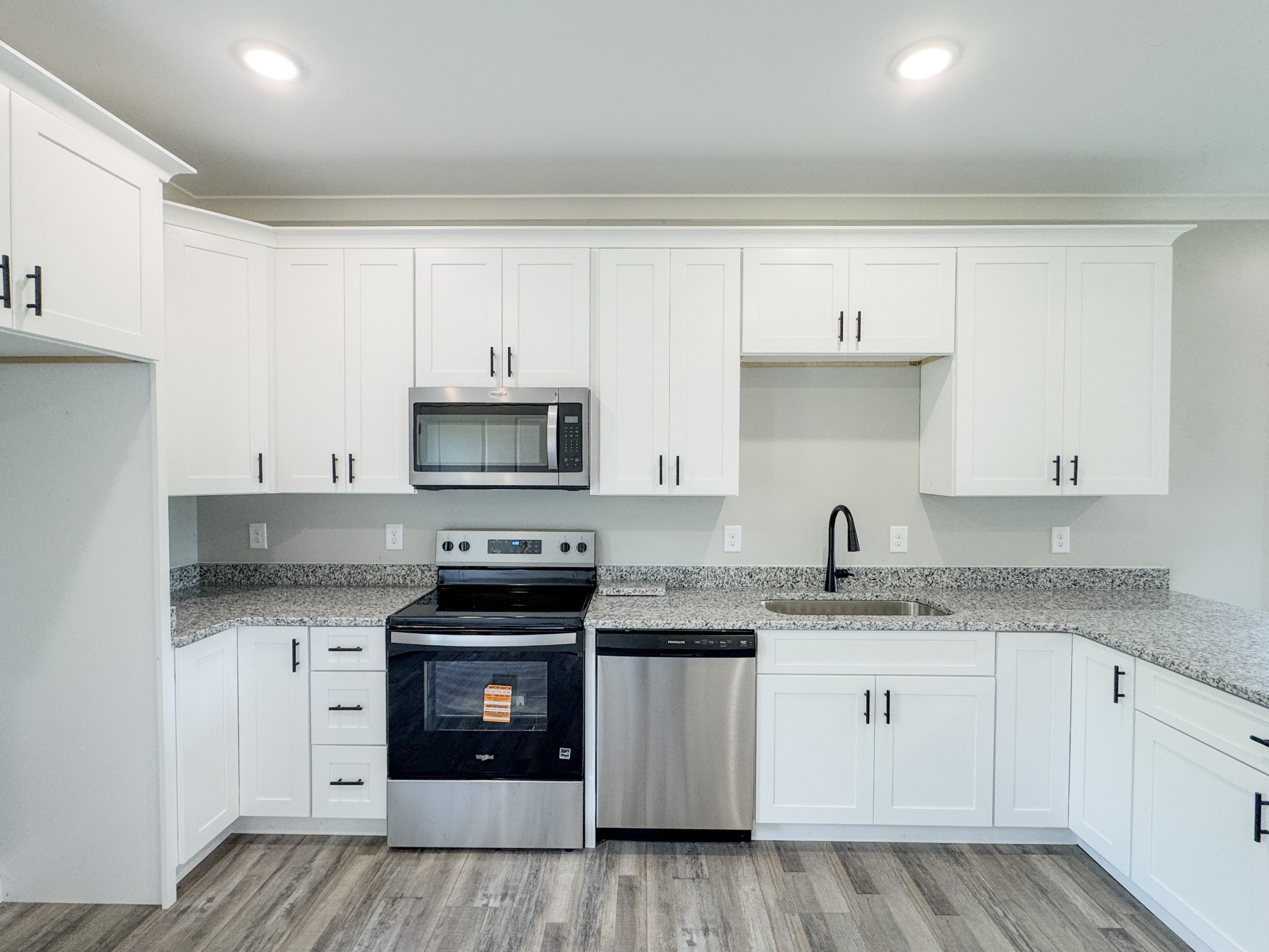 181 Rock House Hollow Road Bethpage, TN 37022 - Photo 20 of 51 a kitchen with stainless steel appliances granite countertop a stove sink and cabinets