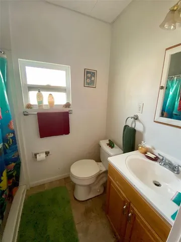 a bedroom with furniture and a lamp