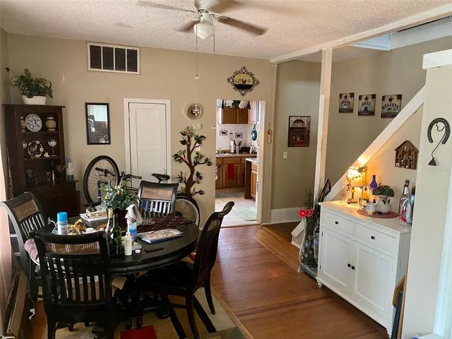a kitchen with stainless steel appliances a stove a sink and a refrigerator
