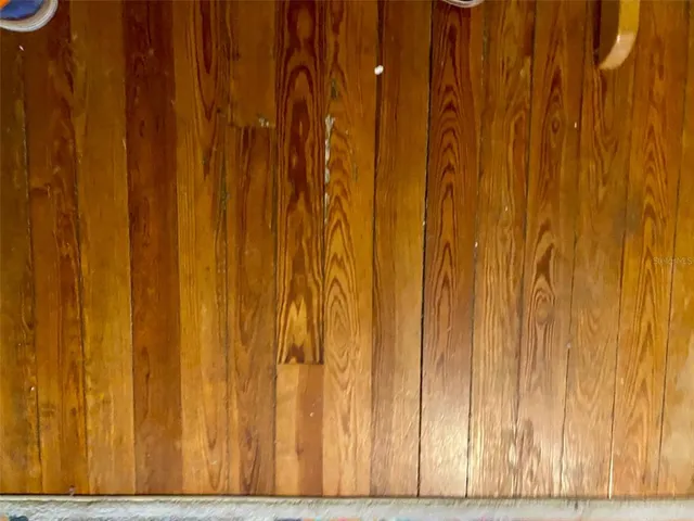 a kitchen with a refrigerator and a stove top oven