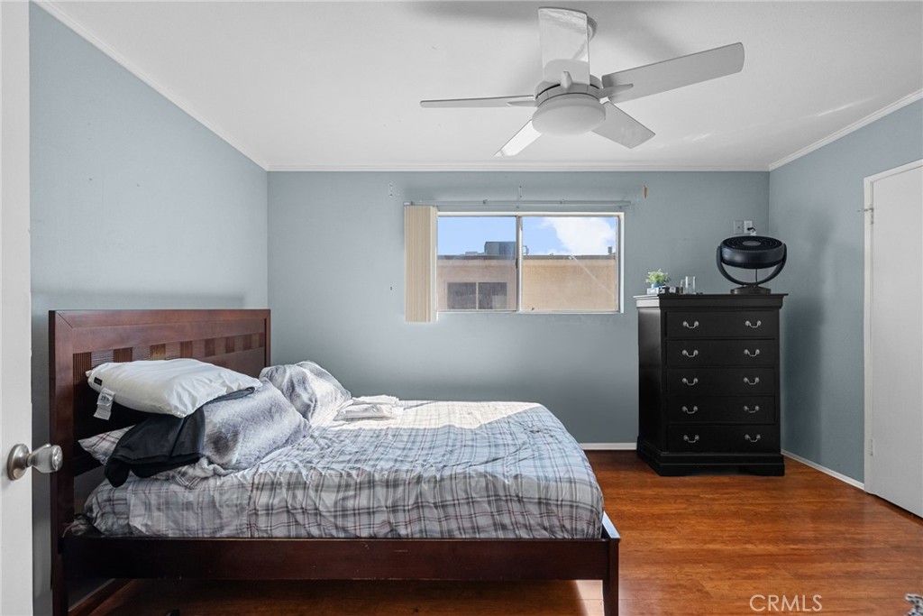 19545 Sherman Way, Unit 74 Reseda, CA 91335 - Photo 15 of 26 a bedroom with a bed and a cabinets