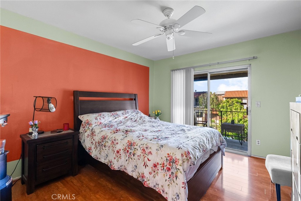 19545 Sherman Way, Unit 74 Reseda, CA 91335 - Photo 18 of 26 a bedroom with a large bed and a chandelier