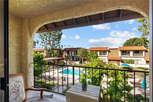 a view of a balcony with an outdoor seating