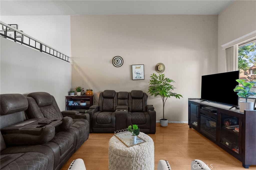 19545 Sherman Way, Unit 74 Reseda, CA 91335 - Photo 4 of 26 a living room with furniture and a flat screen tv