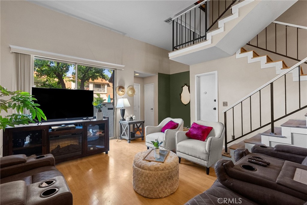 19545 Sherman Way, Unit 74 Reseda, CA 91335 - Photo 6 of 26 a living room with furniture and a flat screen tv