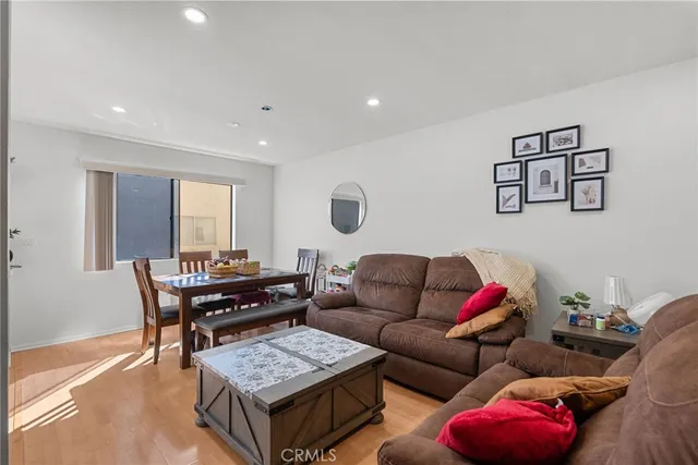 a living room with furniture and a rug