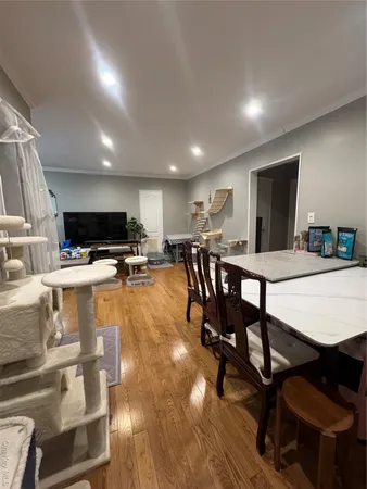 a view of a dining room with furniture and a table