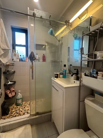 a room with water heater and refrigerator