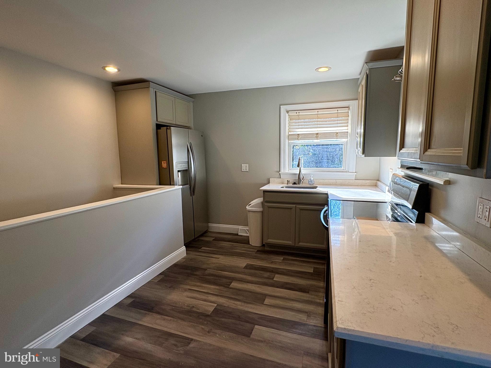 1401 Filbert Street Glassboro, NJ 08028 - Photo 4 of 9 a kitchen with a refrigerator and a sink