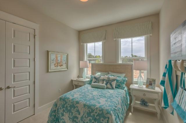 54 Pine Lands Loop Ln Inlet Beach West, Unit B Inlet Beach, FL 32461 - Photo 13 of 35 a bedroom with a bed and a flat screen tv