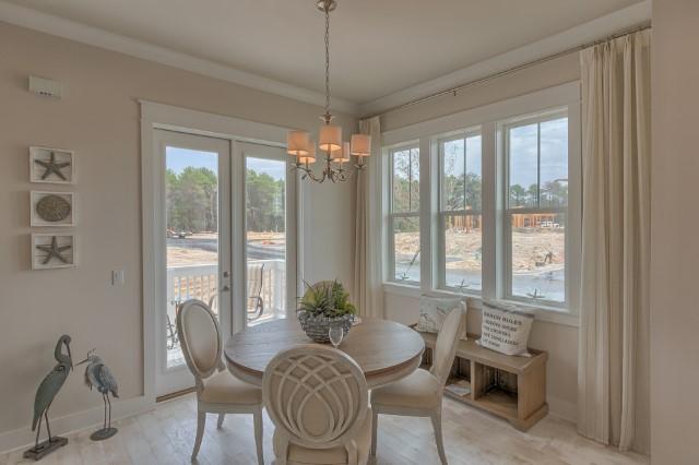 54 Pine Lands Loop Ln Inlet Beach West, Unit B Inlet Beach, FL 32461 - Photo 17 of 35 a view of a dining room with furniture window and outside view