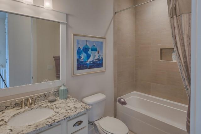 54 Pine Lands Loop Ln Inlet Beach West, Unit B Inlet Beach, FL 32461 - Photo 18 of 35 a bathroom with a granite countertop sink toilet and shower