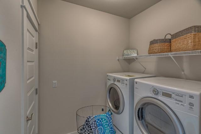 54 Pine Lands Loop Ln Inlet Beach West, Unit B Inlet Beach, FL 32461 - Photo 23 of 35 a utility room with dryer and washer
