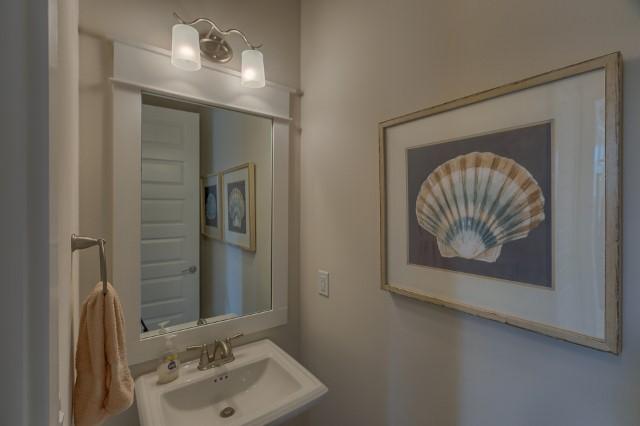 54 Pine Lands Loop Ln Inlet Beach West, Unit B Inlet Beach, FL 32461 - Photo 35 of 35 a bathroom with a sink and a mirror