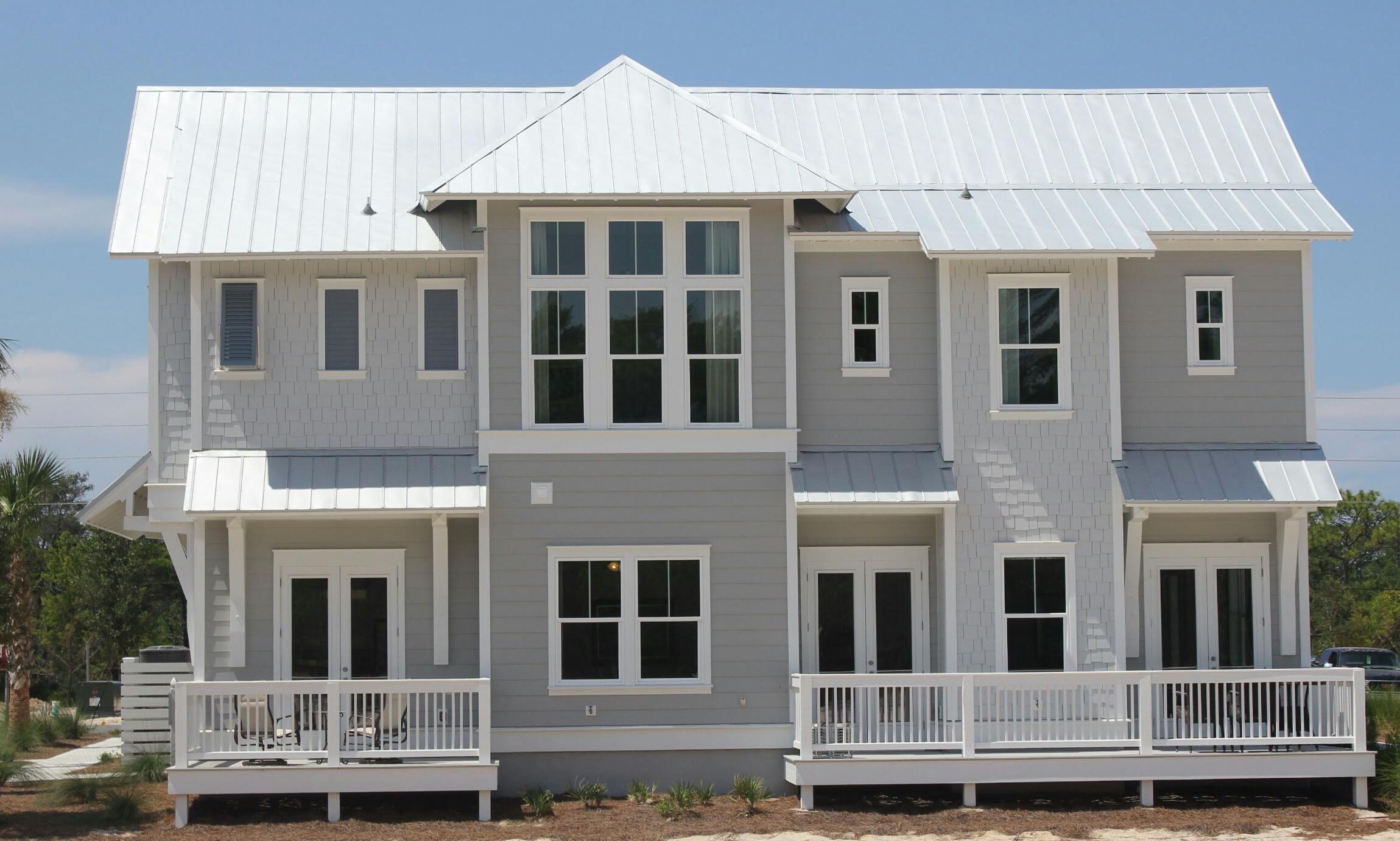 54 Pine Lands Loop Ln Inlet Beach West, Unit B Inlet Beach, FL 32461 - Photo 8 of 35 a front view of a house with balcony