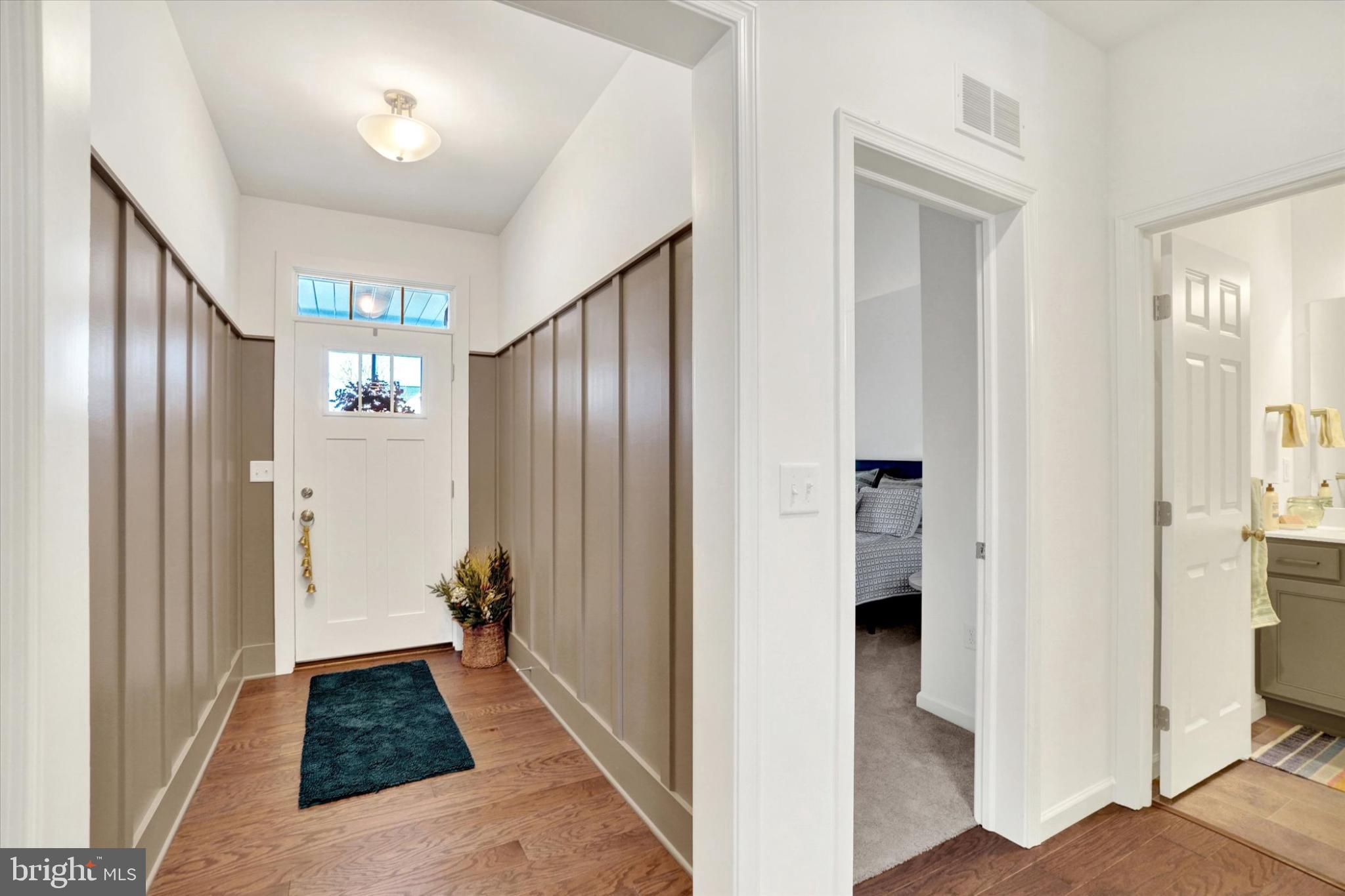 922 Shadowbrooke Dover, PA 17315 - Photo 13 of 25 a view of a hallway with wooden floor and staircase