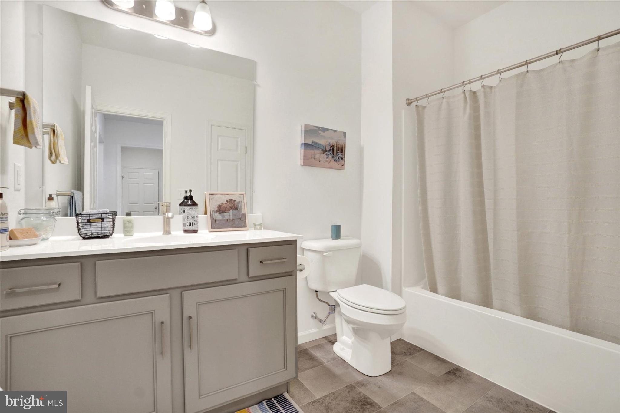 922 Shadowbrooke Dover, PA 17315 - Photo 14 of 25 a bathroom with a sink a toilet and a mirror